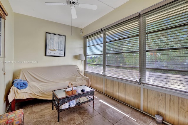 bedroom with tile patterned flooring and ceiling fan