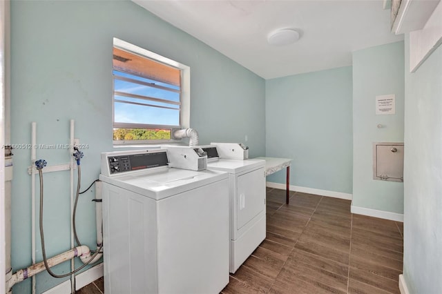 clothes washing area with separate washer and dryer