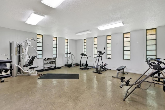 gym with a textured ceiling