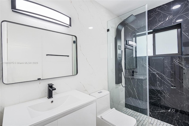 bathroom featuring tasteful backsplash, tile walls, vanity, tiled shower, and toilet