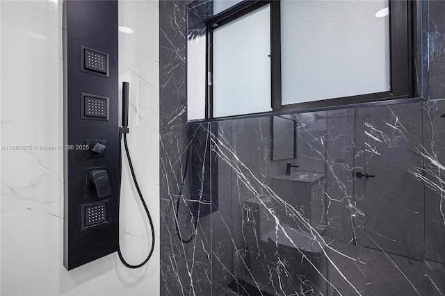 bathroom featuring walk in shower and plenty of natural light