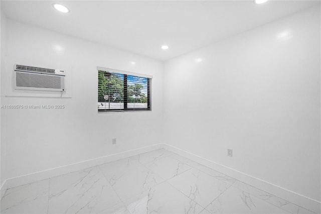 spare room featuring an AC wall unit