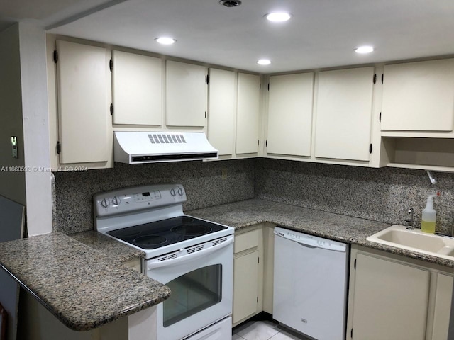 kitchen featuring white appliances, sink, extractor fan, and tasteful backsplash