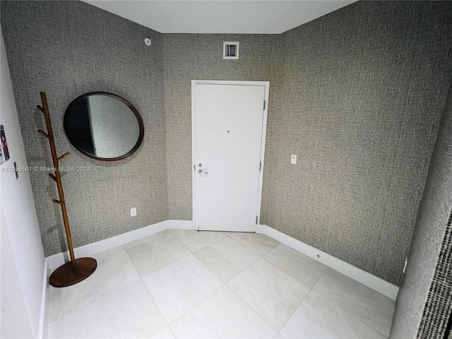 16385 Biscayne Blvd Unit 421, North Miami Beach, FL 33160 - entryway featuring baseboards and light tile patterned flooring