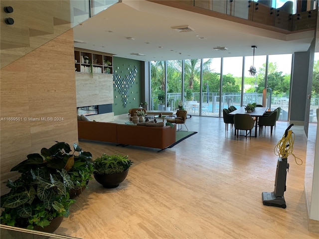 16385 Biscayne Blvd Unit 421, North Miami Beach, FL 33160 - common area with expansive windows and a towering ceiling