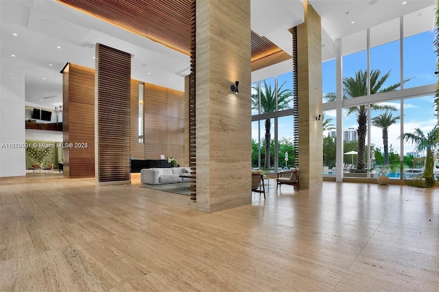 16385 Biscayne Blvd Unit 421, North Miami Beach, FL 33160 - common area featuring a towering ceiling, recessed lighting, and a wall of windows