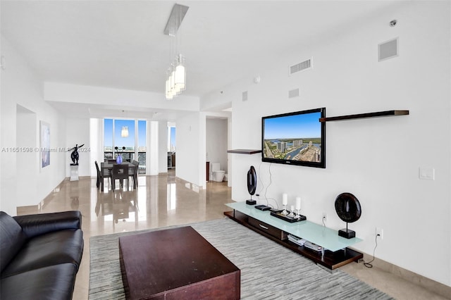 living room featuring a notable chandelier