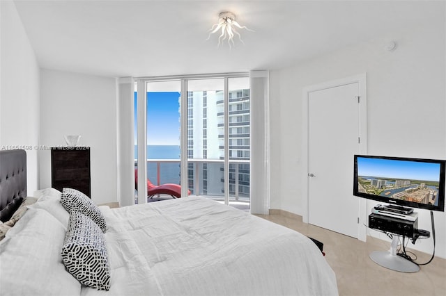 bedroom with a wall of windows