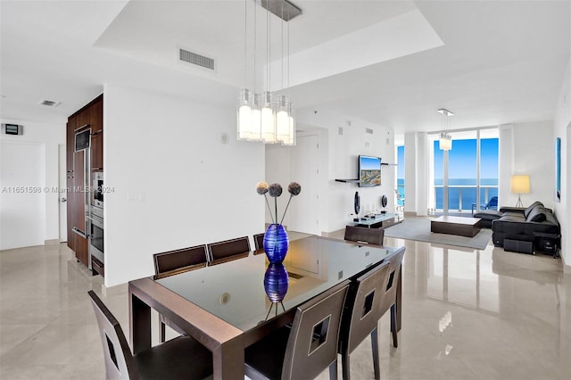 dining area featuring floor to ceiling windows