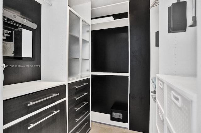 spacious closet with light tile patterned flooring