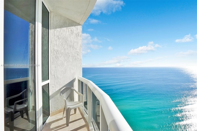 balcony featuring a water view