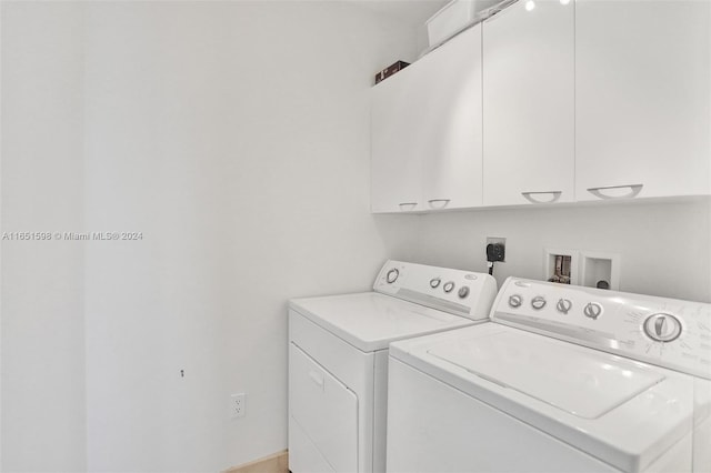 laundry area featuring cabinets and washer and dryer