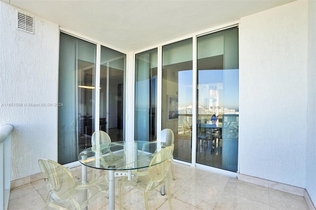 dining room with a wall of windows