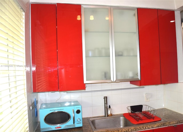 kitchen featuring backsplash and sink