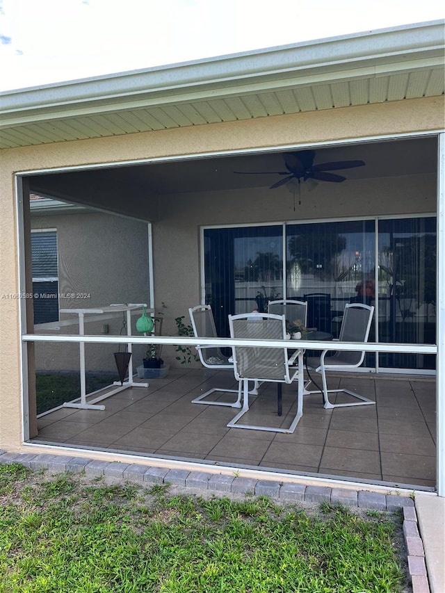 view of patio featuring ceiling fan