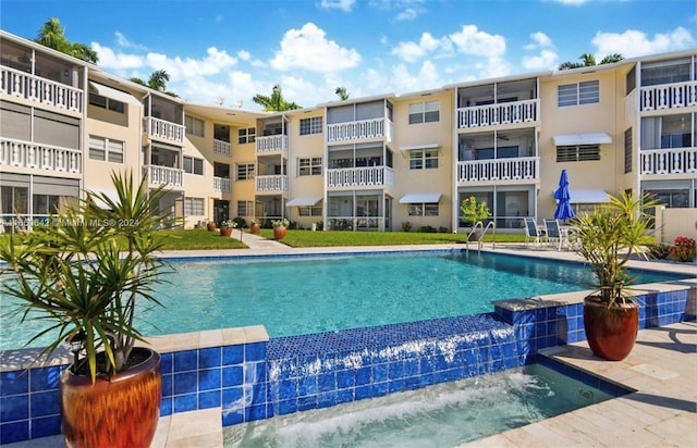 view of pool with pool water feature