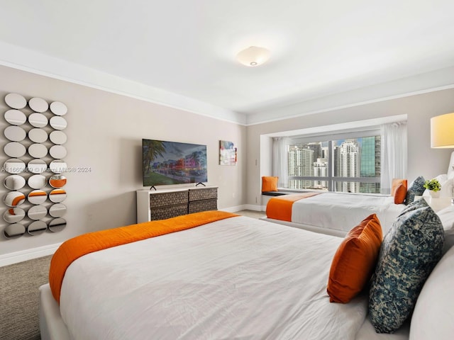 carpeted bedroom with crown molding