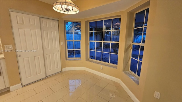 unfurnished room with tile patterned floors