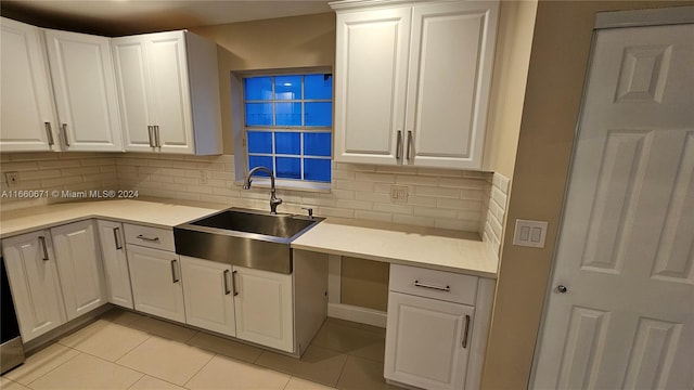 kitchen with sink and white cabinetry