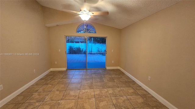 unfurnished room featuring ceiling fan, a textured ceiling, and vaulted ceiling