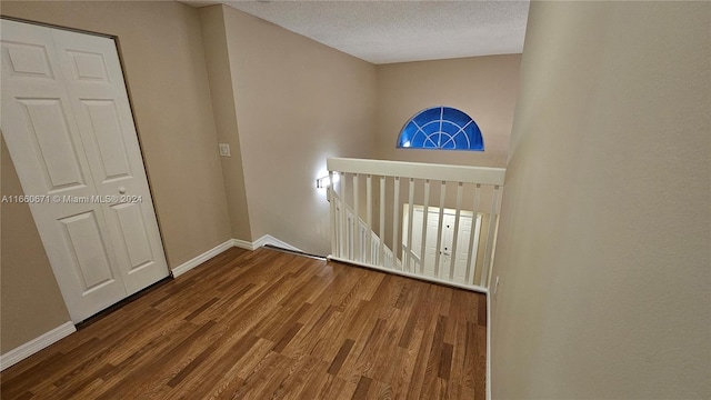 foyer with hardwood / wood-style flooring and a textured ceiling