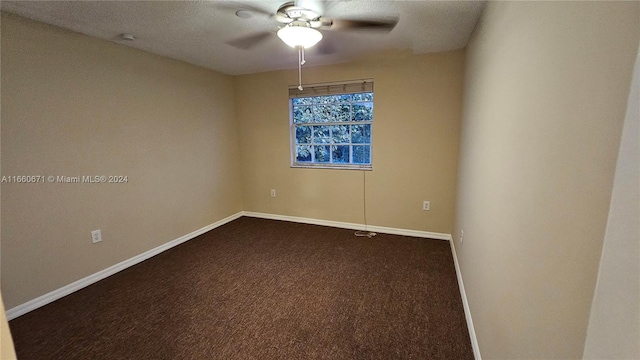 carpeted empty room with a textured ceiling and ceiling fan