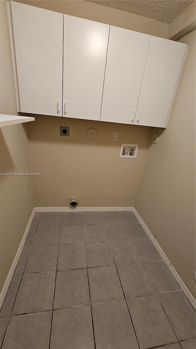 laundry area featuring electric dryer hookup, baseboards, and washer hookup