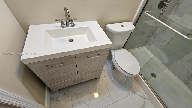 bathroom featuring vanity, toilet, and an enclosed shower