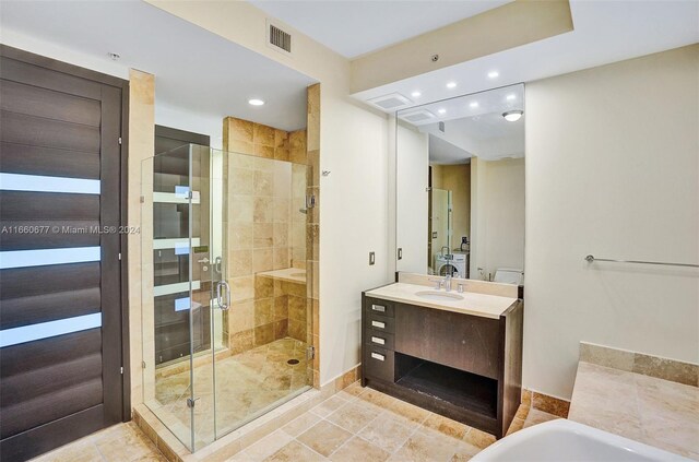 bathroom with vanity, independent shower and bath, and tile patterned flooring