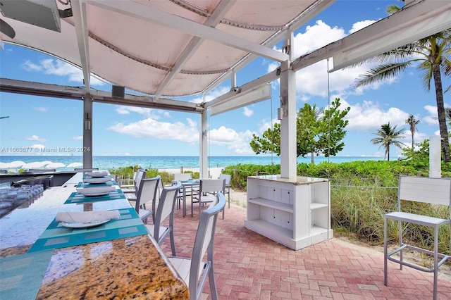 view of patio / terrace featuring a water view and a gazebo