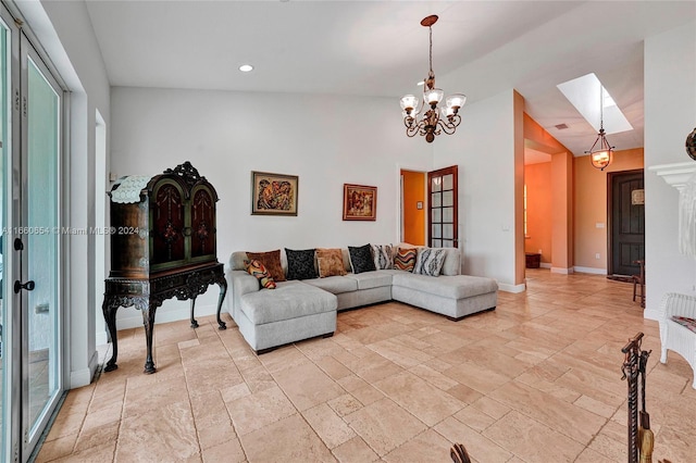 living room featuring a chandelier and lofted ceiling