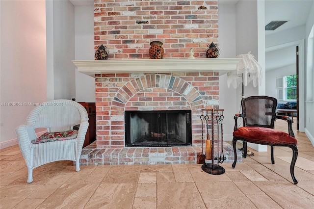 details featuring a brick fireplace