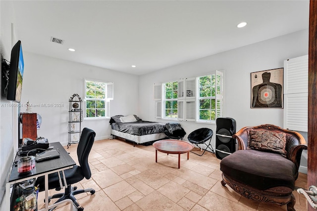 bedroom featuring multiple windows