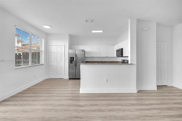 kitchen with white cabinetry, stainless steel fridge with ice dispenser, and light hardwood / wood-style flooring