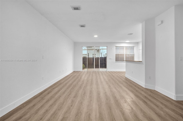 unfurnished living room with light hardwood / wood-style flooring