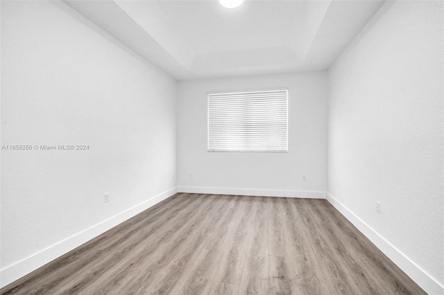 unfurnished room with light wood-type flooring