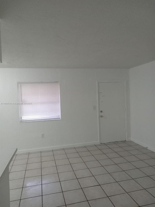 1230 W 54th St Unit 216A, Hialeah, FL 33012 - empty room with light tile patterned floors