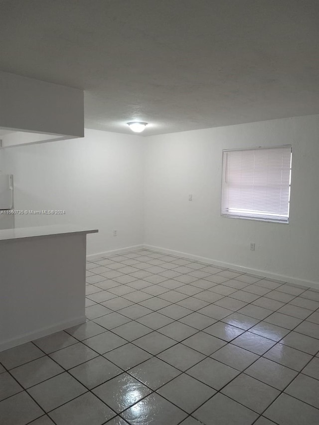 empty room featuring light tile patterned flooring