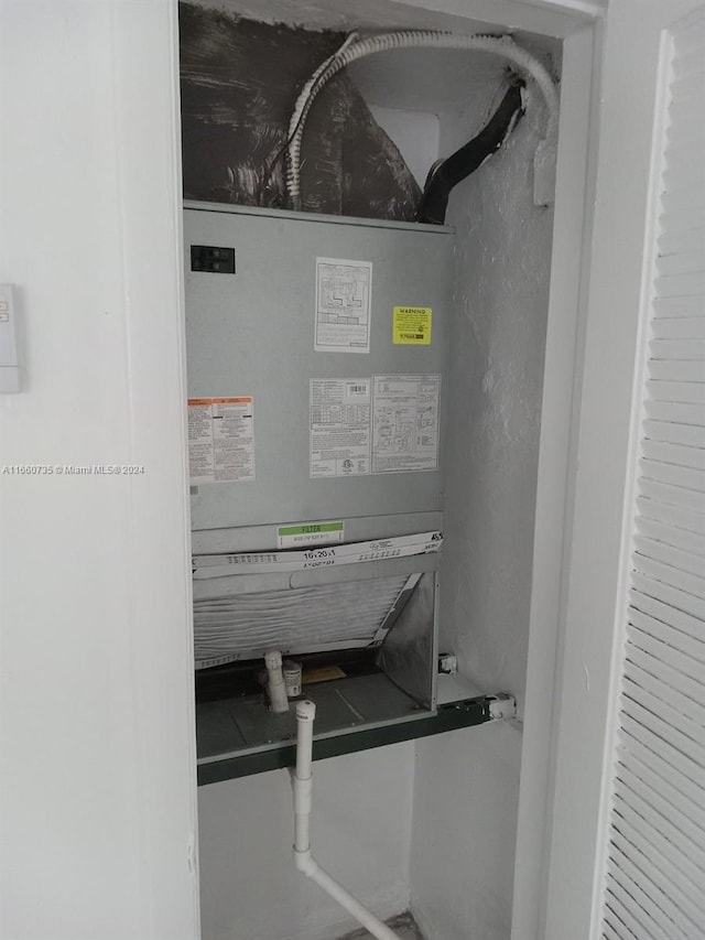1230 W 54th St Unit 216A, Hialeah, FL 33012 - utility room with heating unit