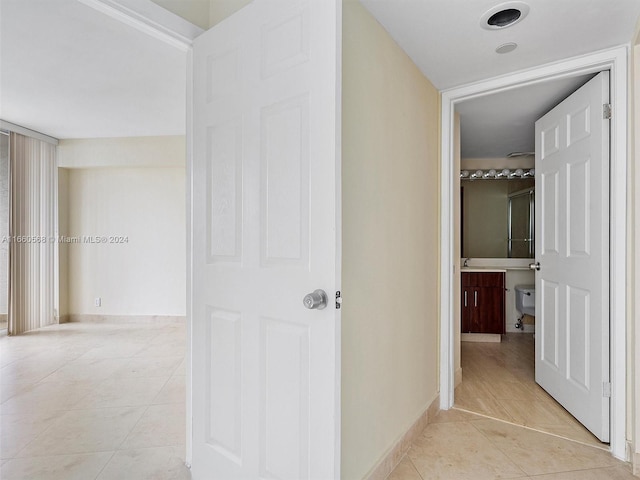 hallway with light tile patterned flooring