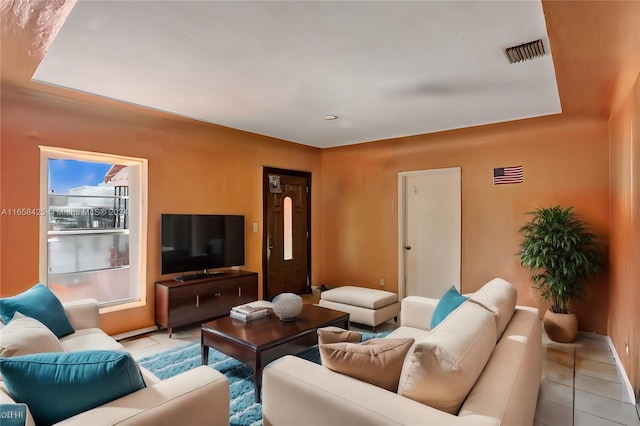 living room with light tile patterned flooring