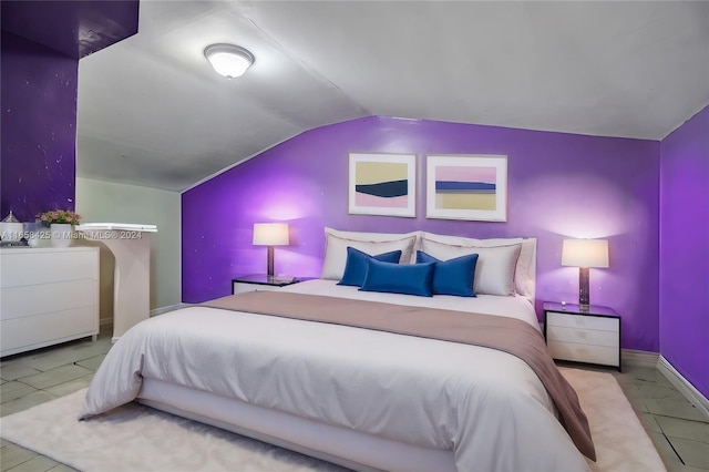 tiled bedroom with vaulted ceiling