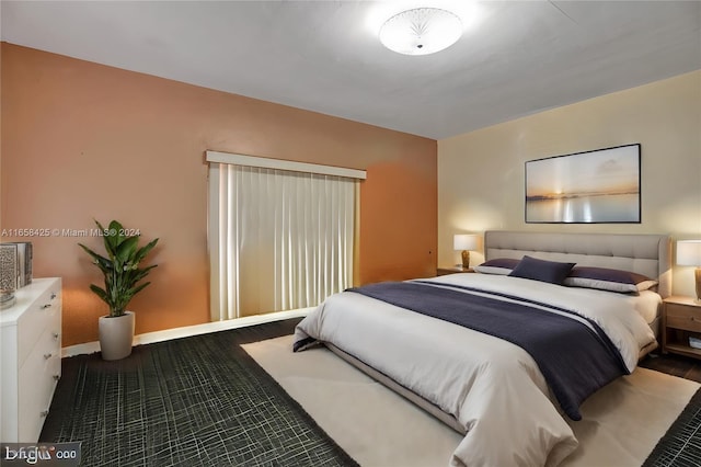 bedroom with wood-type flooring