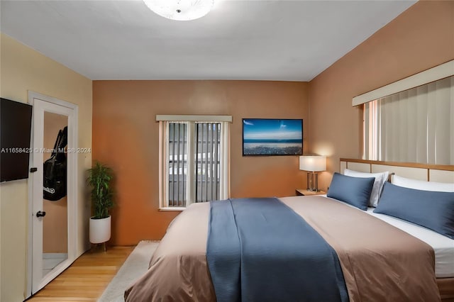 bedroom with light hardwood / wood-style flooring