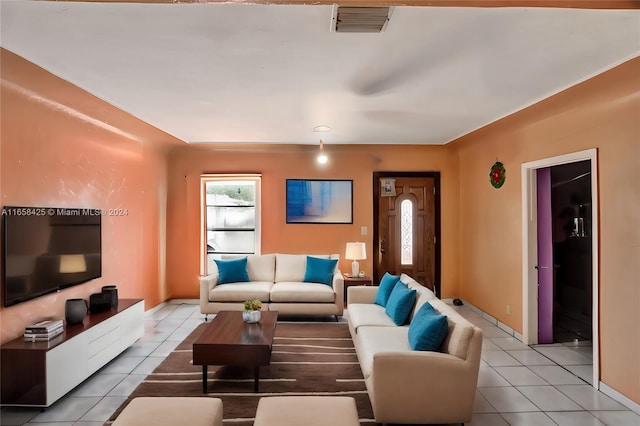 living room with light tile patterned floors