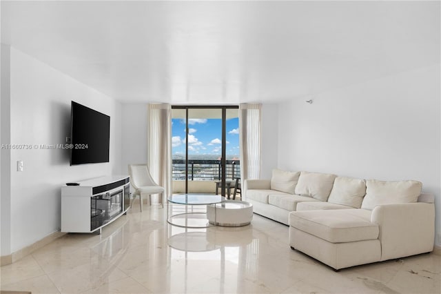 living room featuring a wall of windows