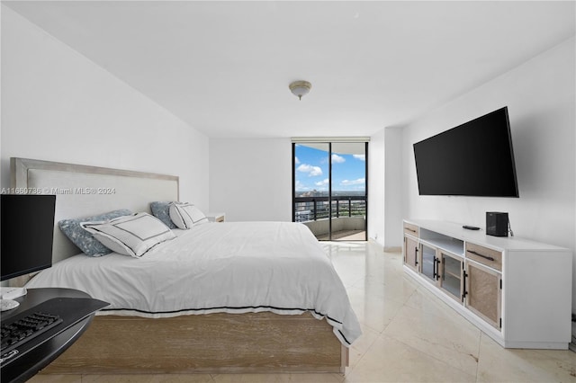 bedroom with floor to ceiling windows and access to outside