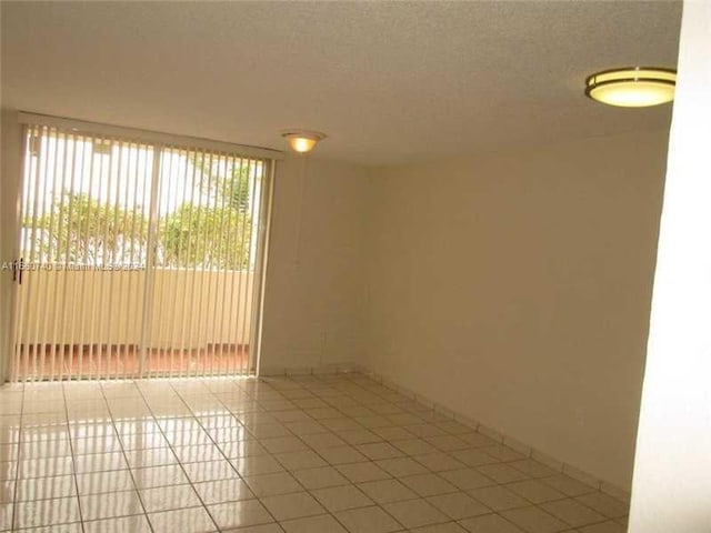 empty room with light tile patterned floors