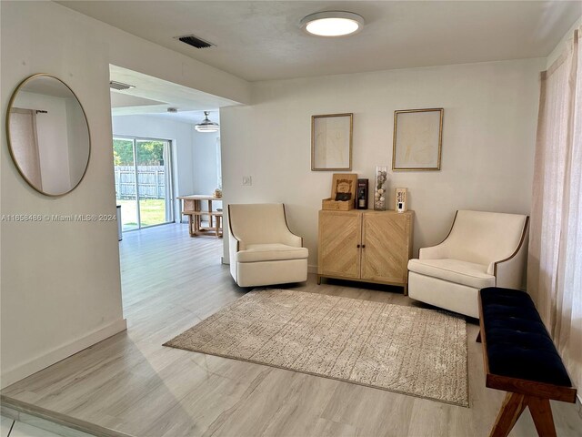 sitting room with light hardwood / wood-style floors