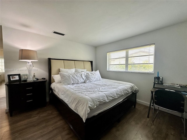 bedroom featuring dark wood-type flooring